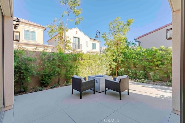 view of patio with a fire pit