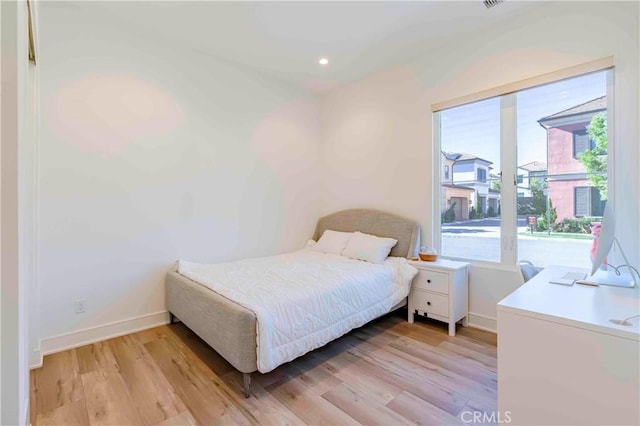 bedroom with light hardwood / wood-style flooring