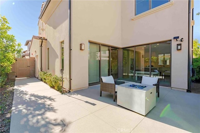 exterior space featuring an outdoor fire pit