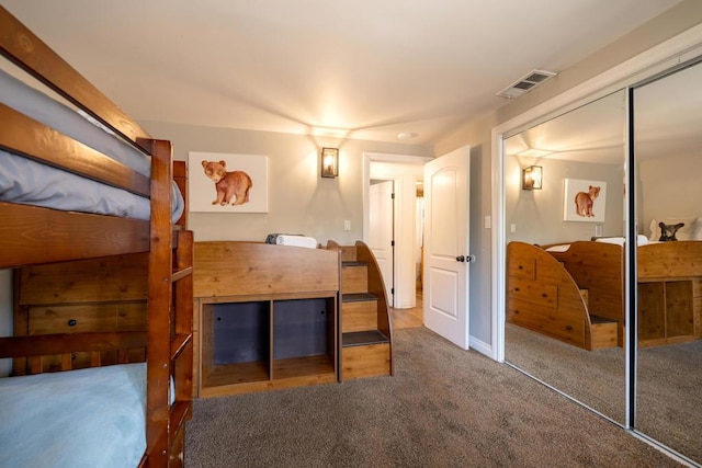 carpeted bedroom featuring a closet