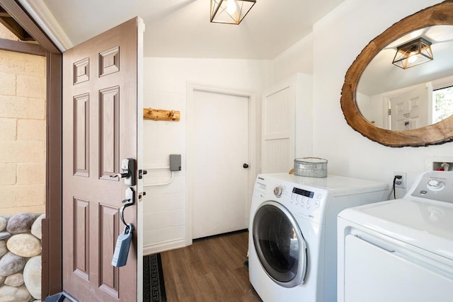 laundry area featuring washer and clothes dryer and dark hardwood / wood-style flooring