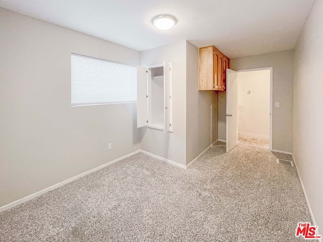 view of carpeted spare room