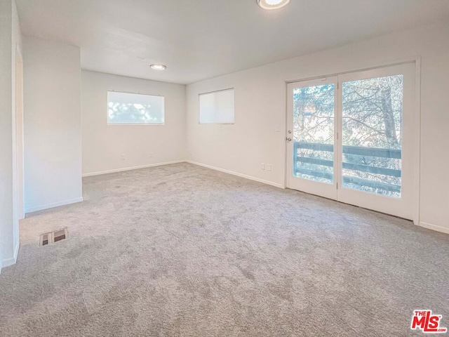 unfurnished room with carpet floors