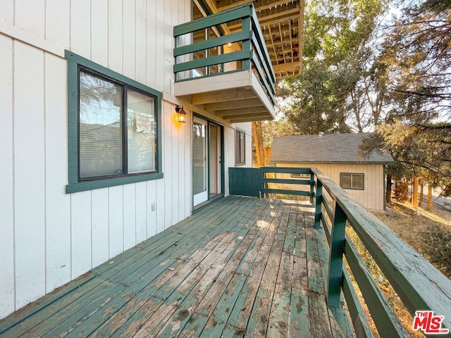 deck with an outbuilding