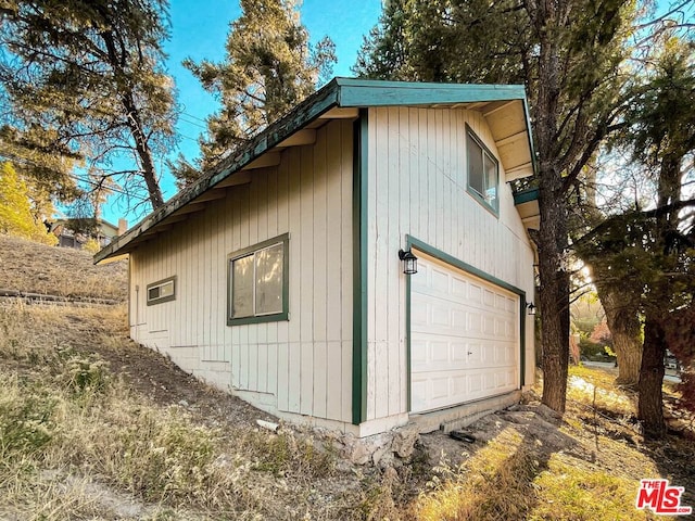 view of side of property with a garage