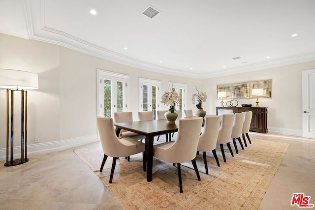 dining space featuring crown molding and french doors