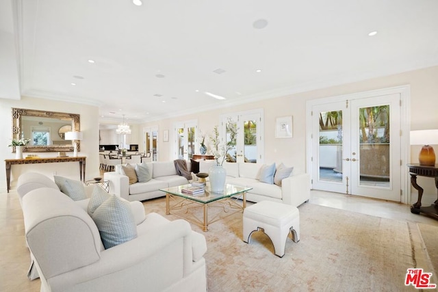 living room with crown molding and french doors