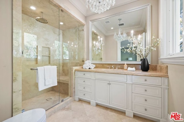 bathroom with toilet, vanity, crown molding, a shower with door, and a chandelier