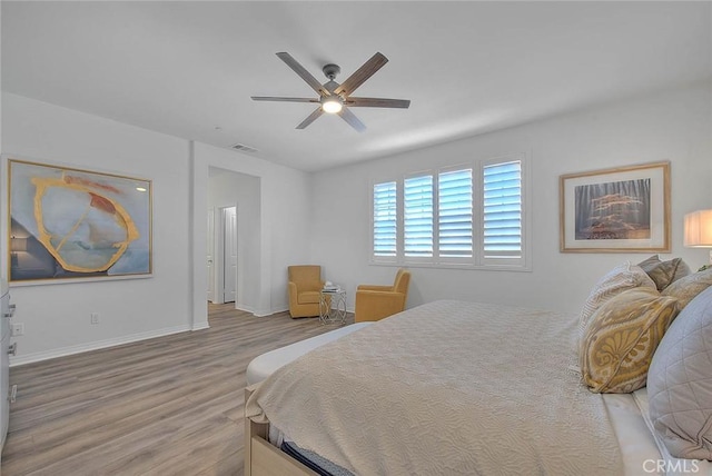 bedroom featuring hardwood / wood-style flooring and ceiling fan