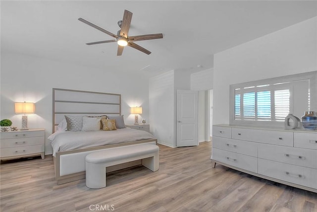 bedroom with ceiling fan and light wood-type flooring