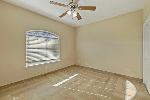 spare room with ceiling fan