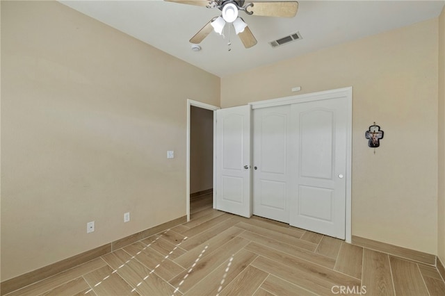 unfurnished bedroom featuring a closet and ceiling fan