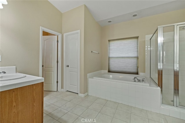 bathroom featuring tile patterned floors, separate shower and tub, and vanity