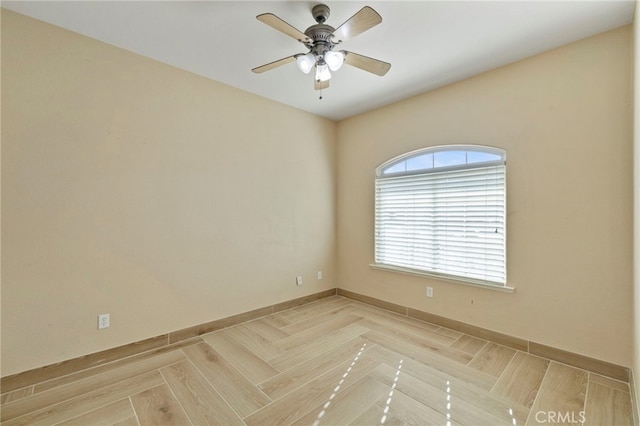 unfurnished room featuring ceiling fan and light parquet flooring