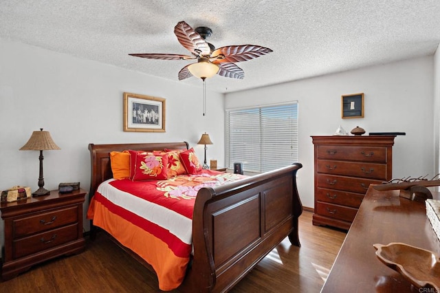 bedroom featuring ceiling fan, wood-type flooring, and a textured ceiling