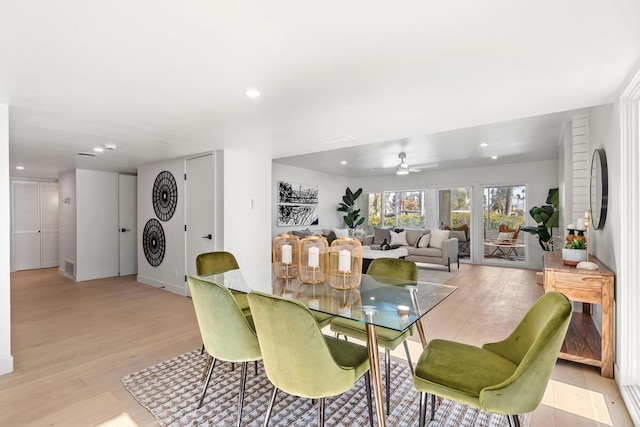 dining room featuring ceiling fan and light hardwood / wood-style floors