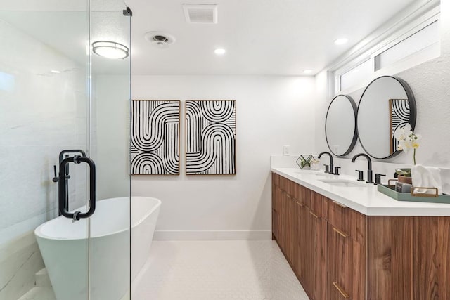 bathroom with a bath and vanity