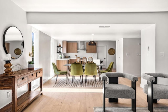 dining area with light hardwood / wood-style flooring