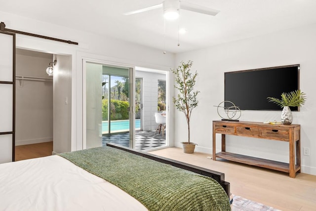 bedroom with ceiling fan, access to exterior, a closet, and light hardwood / wood-style flooring