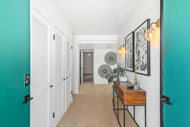 hallway with light wood-type flooring