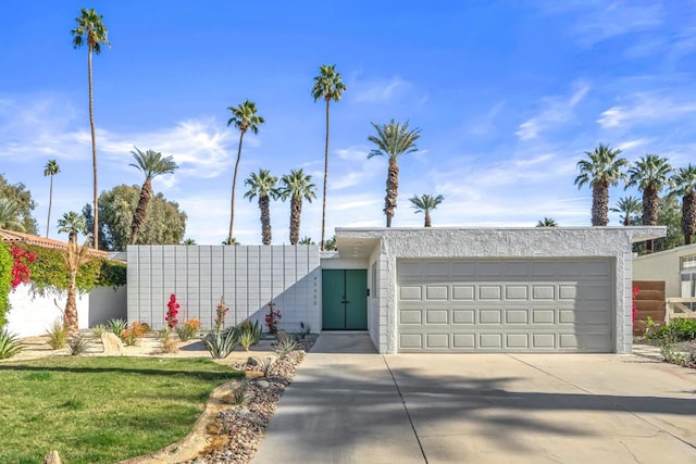 view of front facade with a front yard and a garage