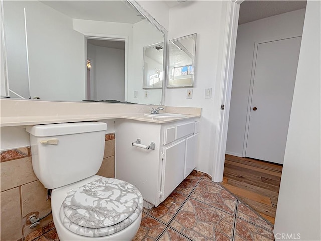 bathroom with vanity and toilet