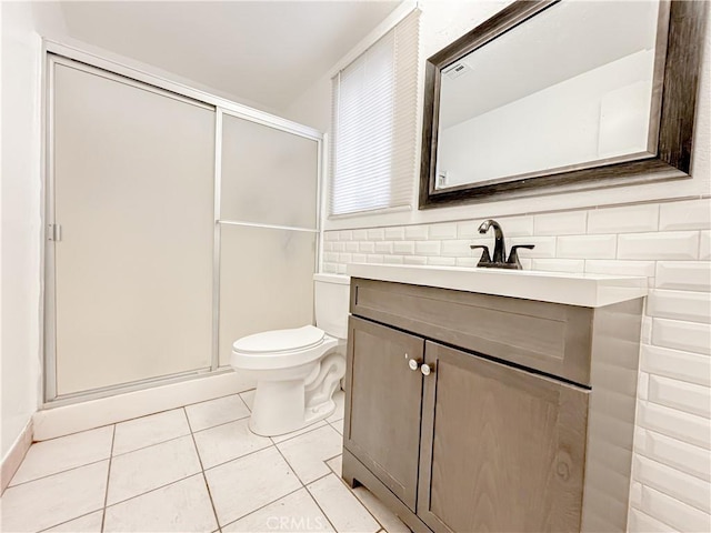 bathroom featuring vanity, an enclosed shower, tile patterned floors, and toilet