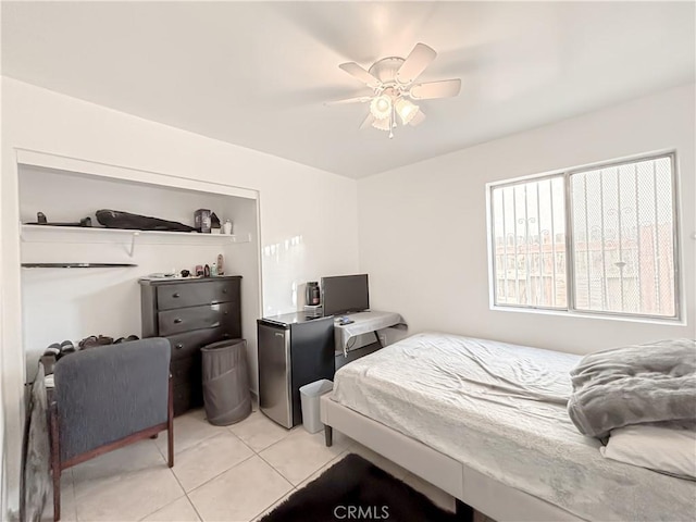 bedroom featuring light tile patterned flooring and ceiling fan