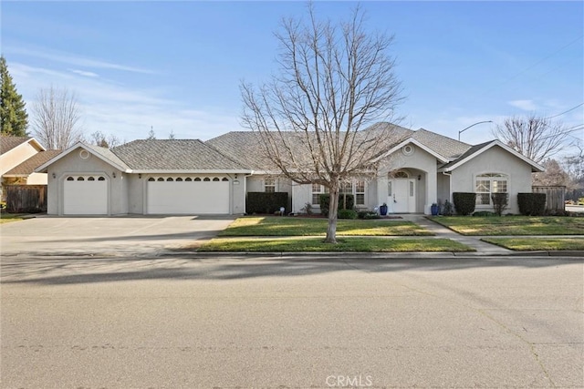 single story home with a garage and a front yard