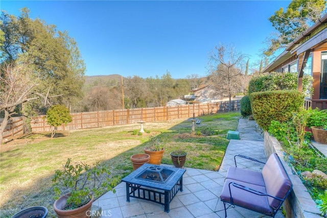 view of patio / terrace featuring an outdoor fire pit