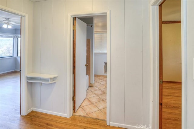 corridor with wood-type flooring