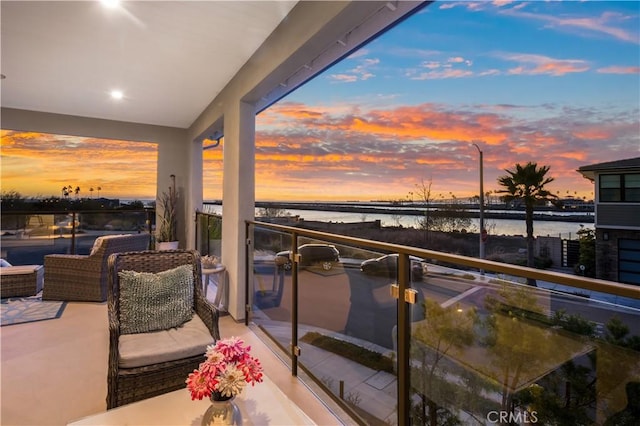 balcony at dusk with a water view