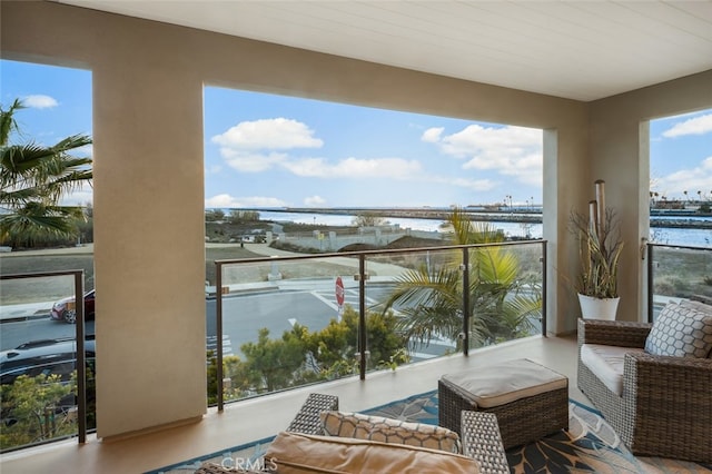 balcony featuring a water view