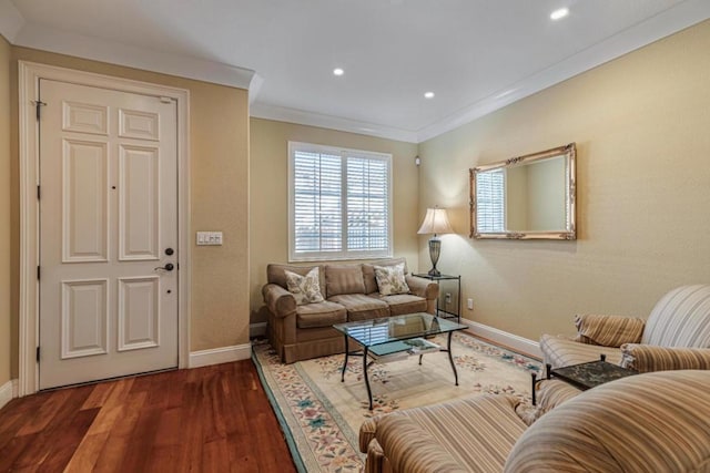 living room with dark hardwood / wood-style floors and crown molding