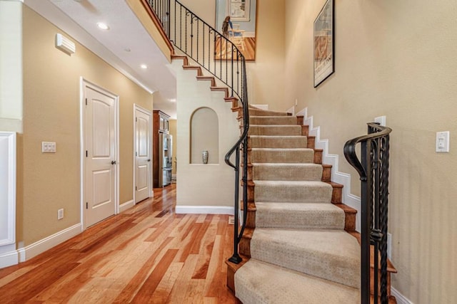 staircase featuring hardwood / wood-style flooring