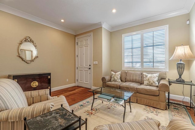 living room with hardwood / wood-style flooring and ornamental molding