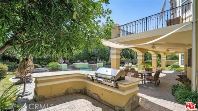 view of patio / terrace with ceiling fan, a balcony, and area for grilling