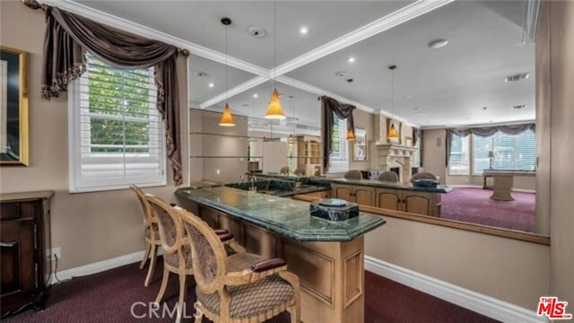 bar featuring ornamental molding, dark carpet, and hanging light fixtures