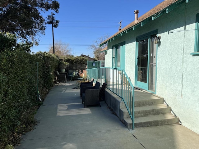 view of property exterior with a patio