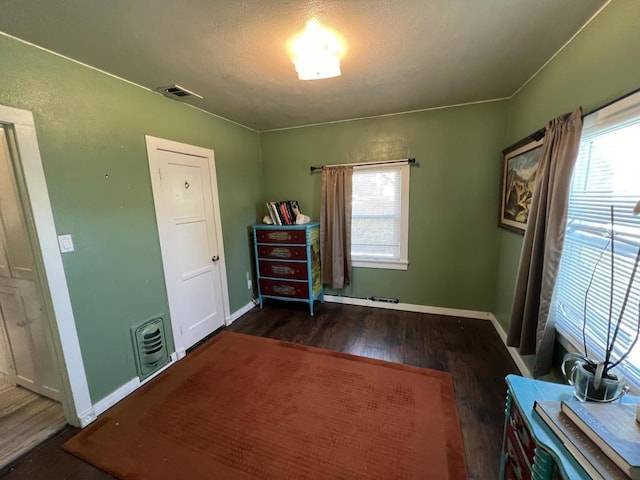 misc room with dark wood-type flooring