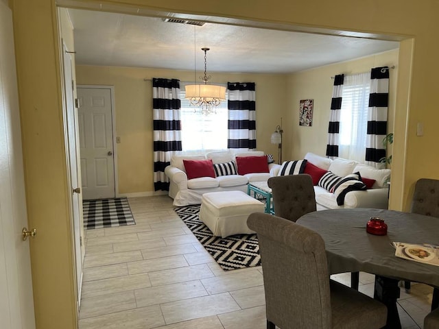 dining area with an inviting chandelier