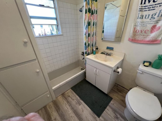 bathroom featuring walk in shower, vanity, toilet, and hardwood / wood-style floors