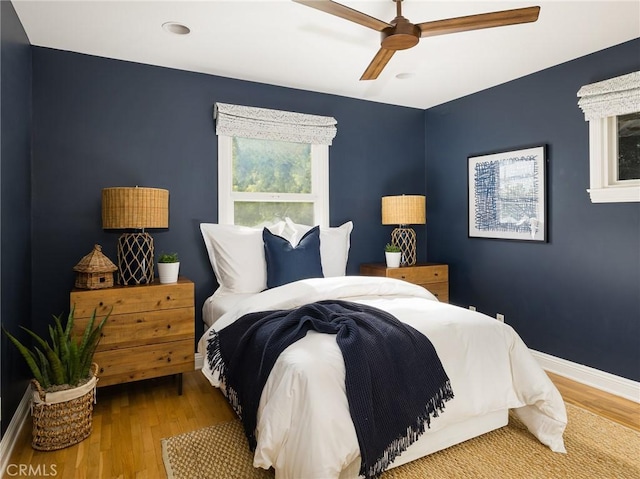 bedroom featuring wood-type flooring and ceiling fan