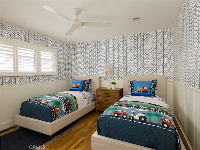 bedroom with hardwood / wood-style flooring and ceiling fan