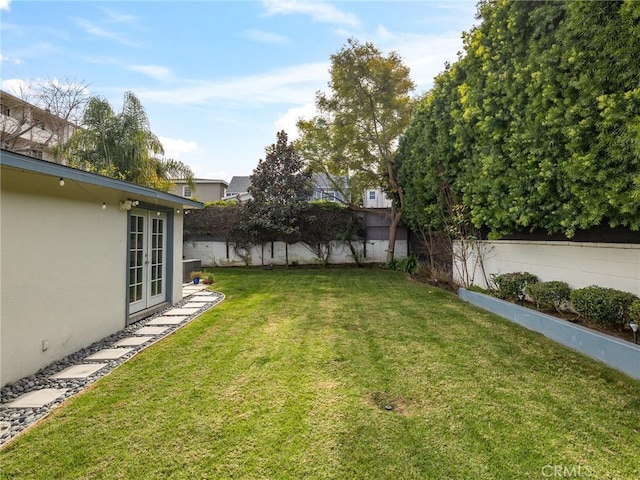 view of yard with french doors