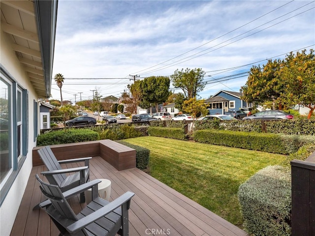 wooden terrace with a yard