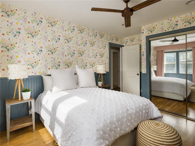 bedroom featuring a closet, ceiling fan, and light hardwood / wood-style floors