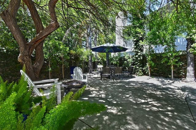 view of patio / terrace featuring a fire pit