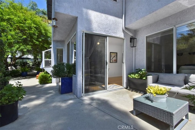 doorway to property with a patio