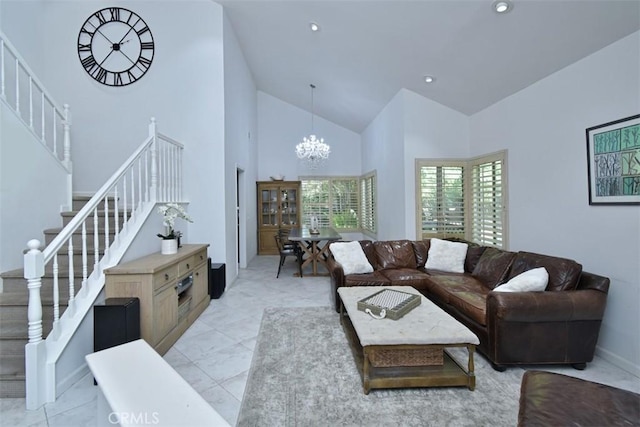 tiled living room with high vaulted ceiling and a chandelier